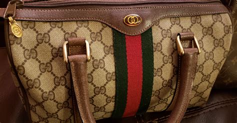 how to tell if a vintage gucci bag is real|knockoff used gucci purses handbags.